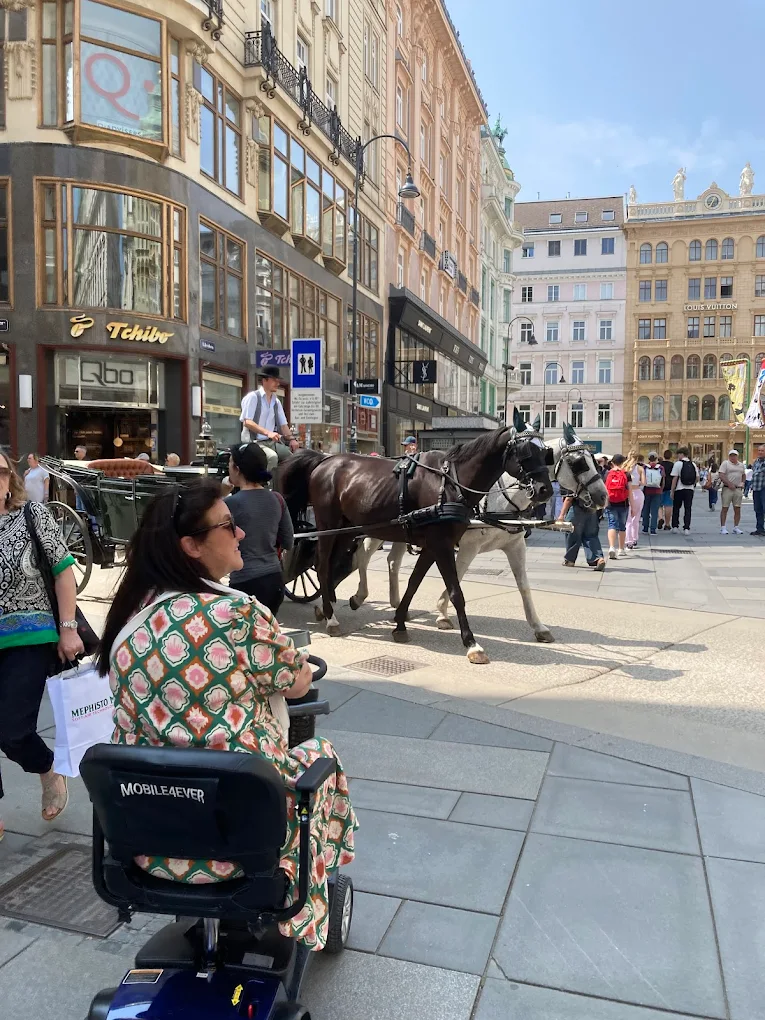 Mobile4Ever customer exploring Vienna Graben on mobility scooter